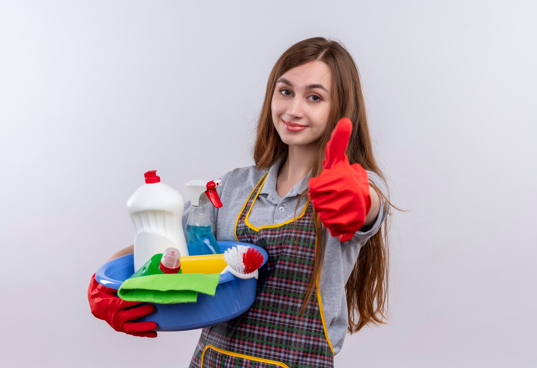 young-beautiful-girl-apron-rubber-gloves-holding-basin-with-cleaning-tools-smiling-showing-thumbs-up